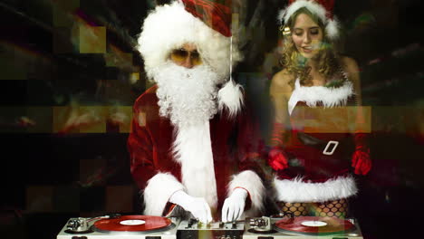 santa claus and woman in xmas costume for christmas time disco shoot