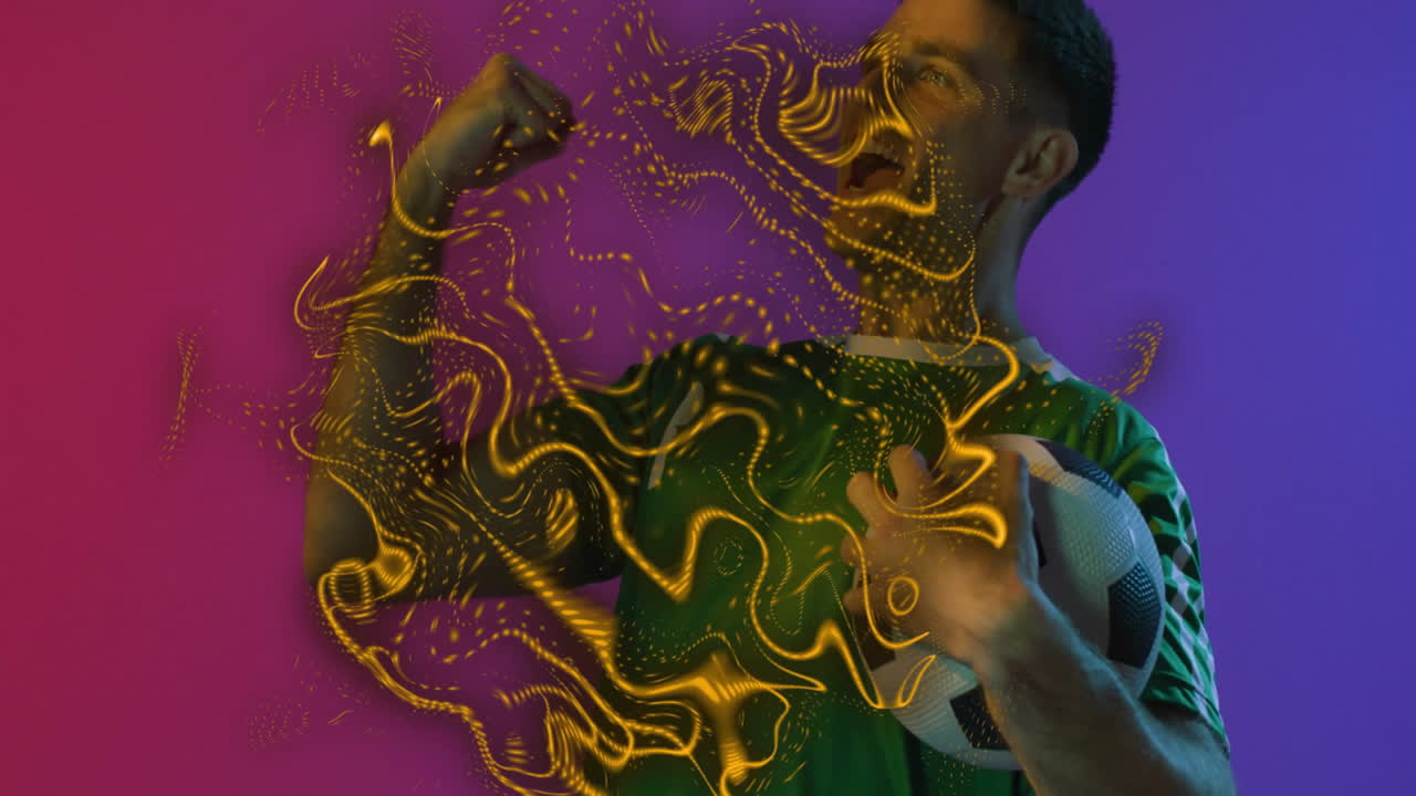 Celebrating with soccer ball, man surrounded by swirling yellow light animation