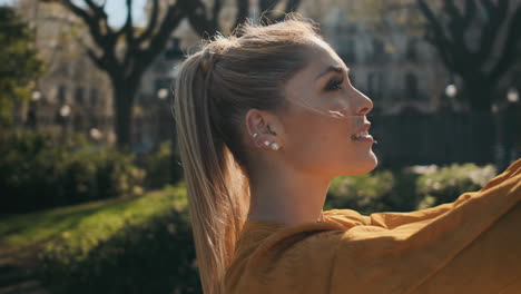 stylish young woman taking pictures outdoor.