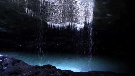 icicles melting over cold stream