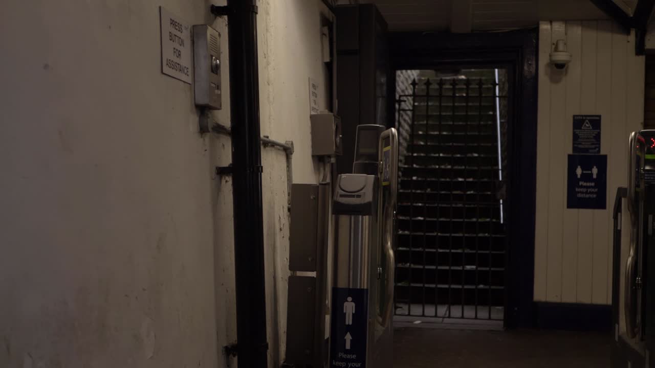 Creepy lonely stone staircase exit in train station wide shot