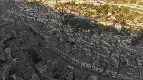 wide view of modica town at sicily during sunrise, aerial