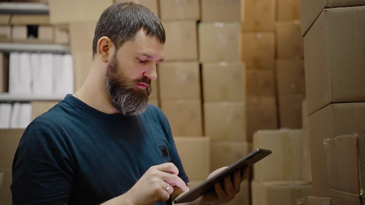 Warehouse Worker Using Tablet