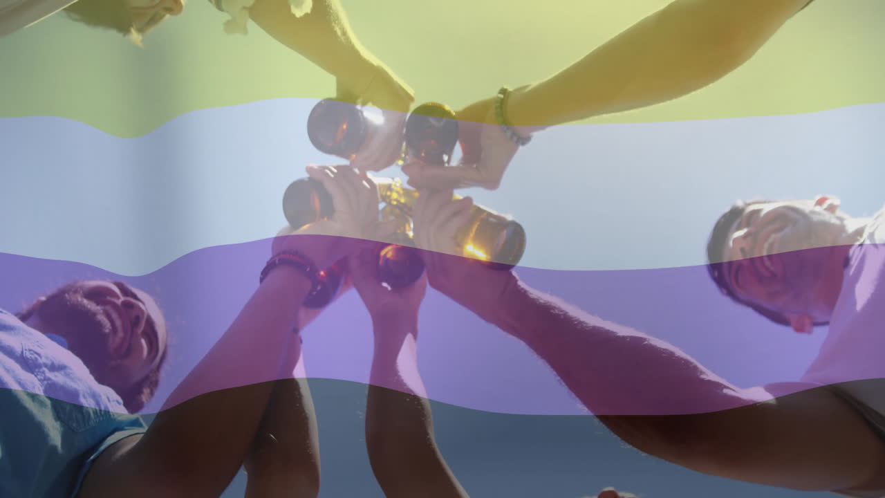 Raising bottles in celebration, people under colorful striped animation overlay