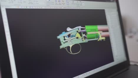 3d graphic designer is working on a rifle concept with a hi-tec mouse