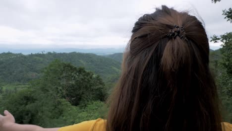 woman's head zooms out from her left side to reveal her stands stretched out suggesting her joy of being with nature