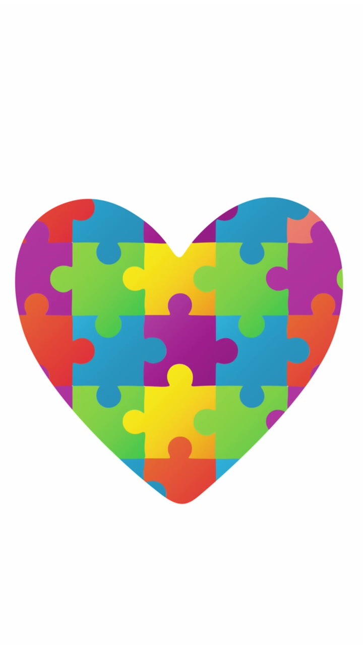 Pezzi colorati di un puzzle che formano una forma di cuore.