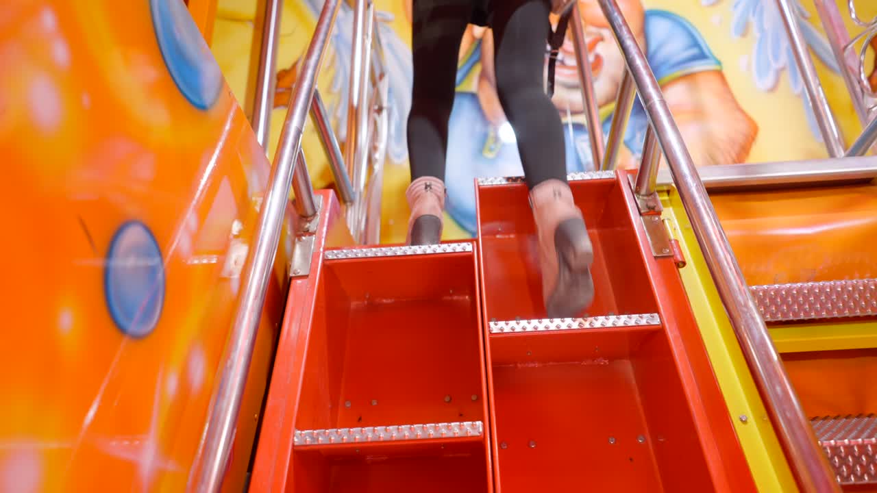 Climbing Colorful Amusement Park Stairs