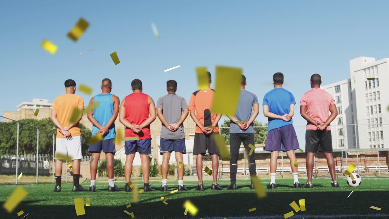 경기장에서 남자 축구 팀의 뒷면으로 떨어지는 콘페티의 애니메이션