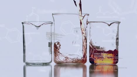 laboratory beakers with data and structural formula of chemical compounds in the foreground