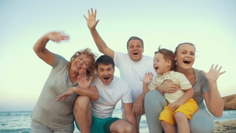 big happy family waving hands