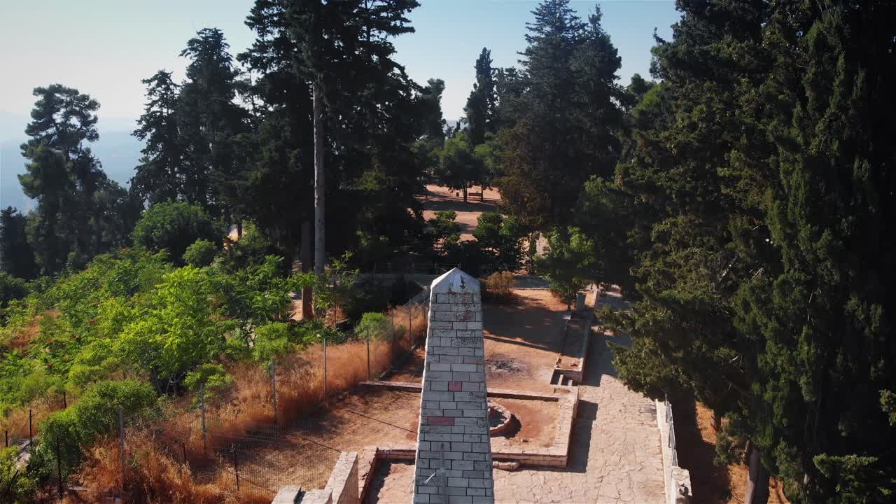 Stone Monument in a Forested Park on a Sunny Day