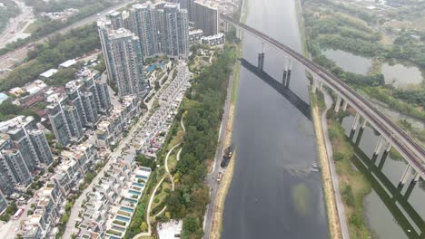 aerial view of an mtr train bridge crossing in sha tin, hong kong