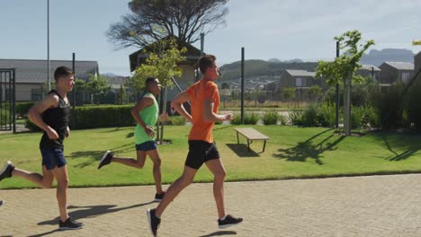 Men-running-outside-on-sunny-day