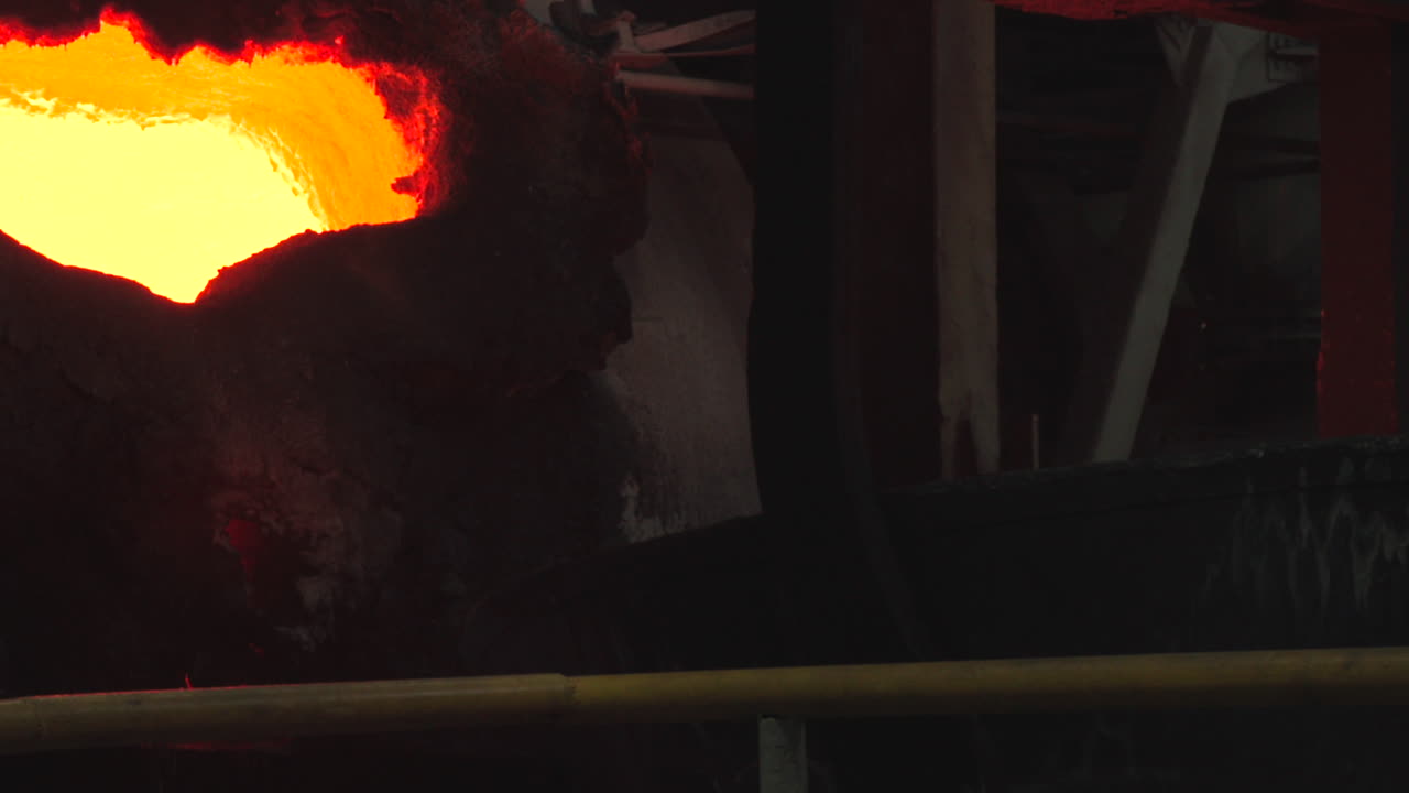 Molten Metal Glowing Inside a Hot Industrial Furnace