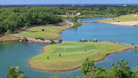 Aerial telephoto shot of players at the PGA Ocean&#039;s 4 Golf course in sunny Dominican republic