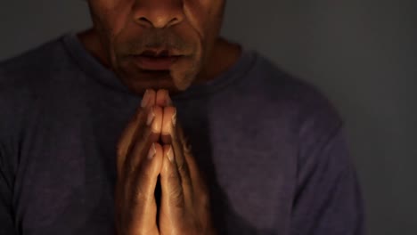 man praying to god with hands together on grey background stock video