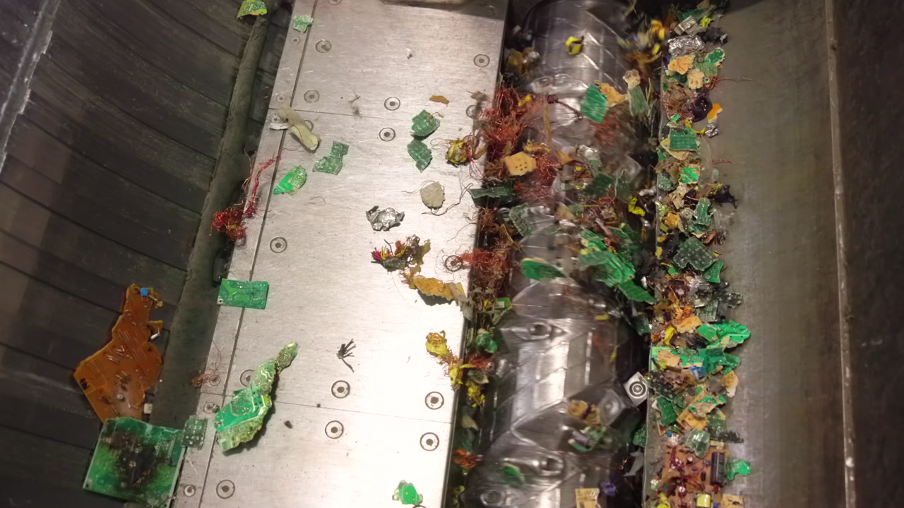 Industrial Waste Shredder Processing Mixed Plastic Scraps Inside Stainless Steel Chamber Rotating Helical . Media