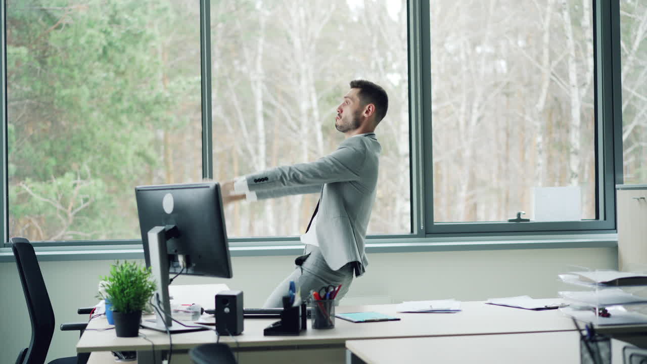 Happy Businessman Dancing in Office