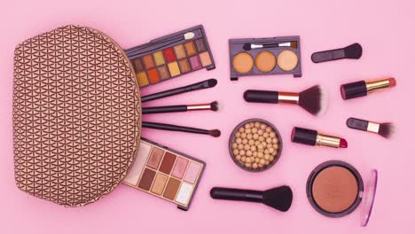 make up products move  next to makeup kit on pink theme. stop motion