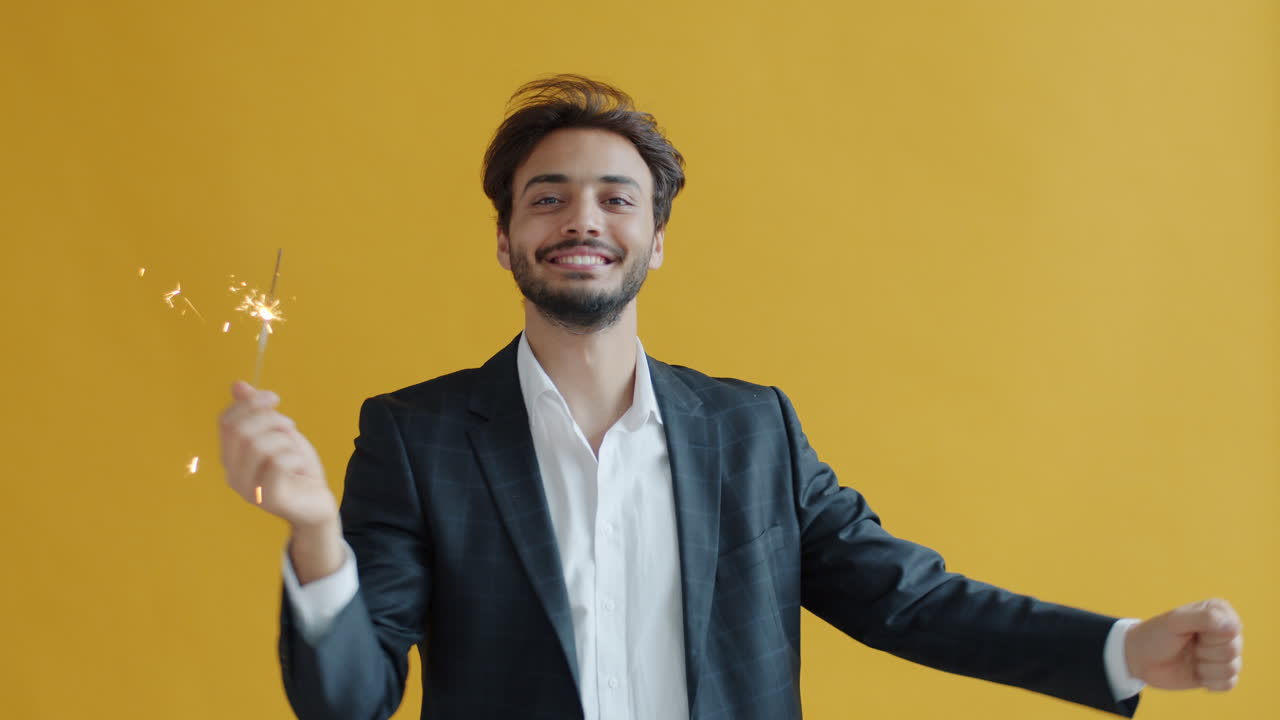 Man Celebrating with Sparkler