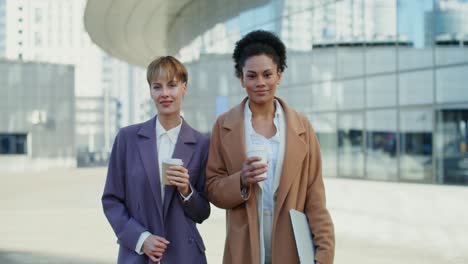 two businesswomen enjoying coffee break