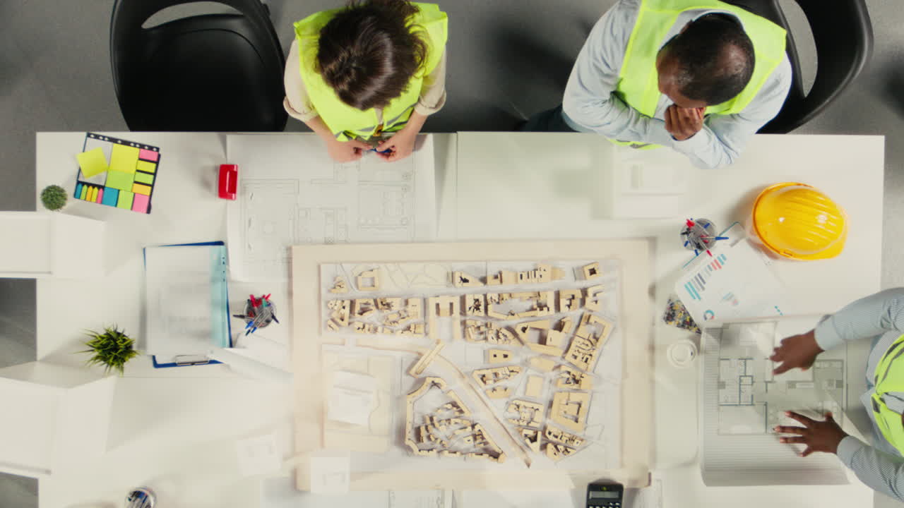 Vertical Video Top down view of developers in modern office environment