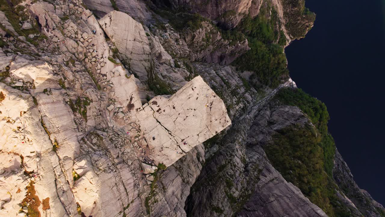 Preikestolen Pulpit Rock plateau, Norway. Fjord views. Elevated top down shot of hikers and tourists
