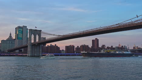 the manhattan skyline rises over the east river
