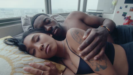 romantic couple taking a nap at home