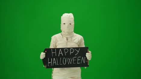 green screen isolated chroma key video capturing a mummy dancing and singing actively into the - green screen isolated chroma key video capturing a mummy dancing and singing actively into the microphone. haloween holidays. mock up, workspace for your promotion clip or advertisement