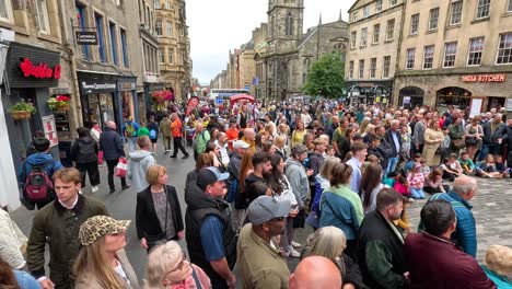 crowd gathers for lively street performance