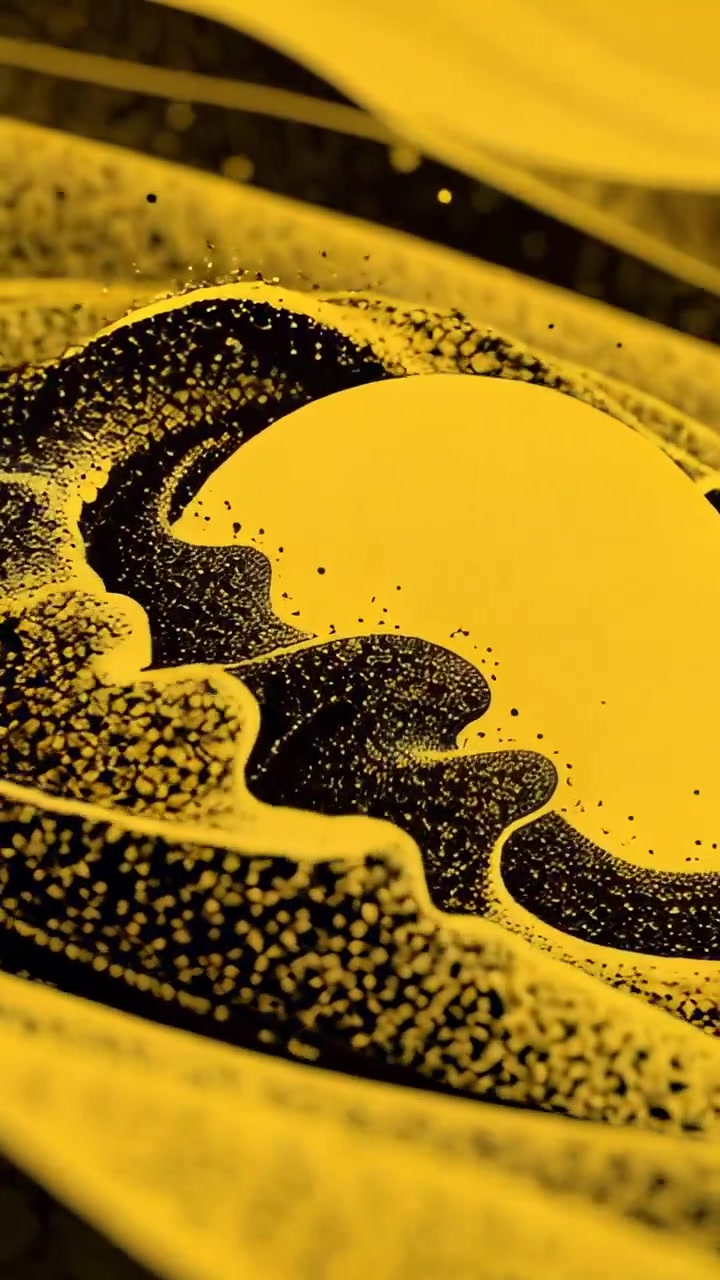 Video verticale: Inizio del movimento che spinge grani neri in senso orario su un disco giallo in una camera sigillata.