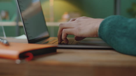 person typing on a laptop