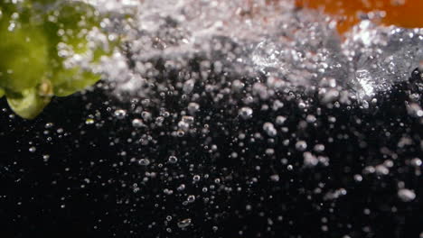 food slow motion bell peppers splash in clean water with bubbles