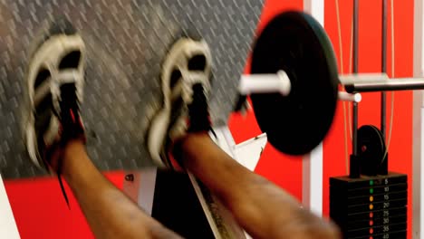 athlete doing leg press exercise 4k