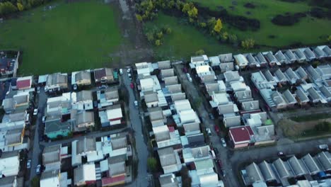 over flight of a small city surrounded by trees and fields