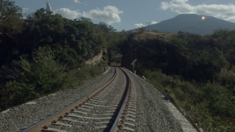 railroad tracks and tunnel alongside the country