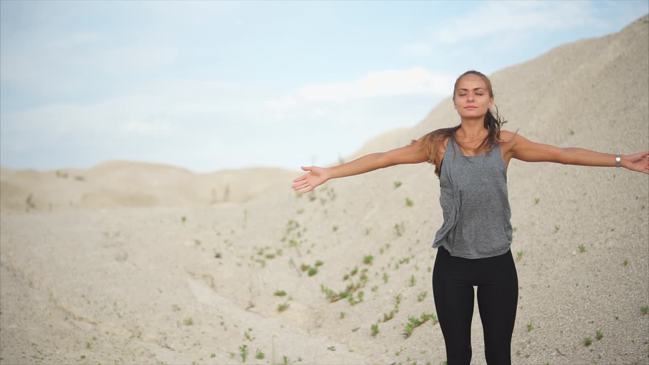 Woman exercising in a desert landscape