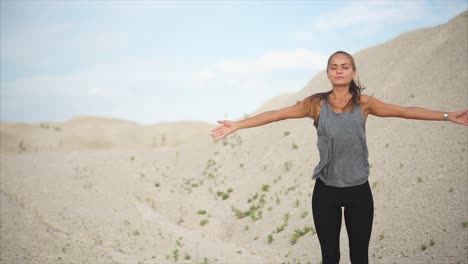 woman exercising in a desert landscape