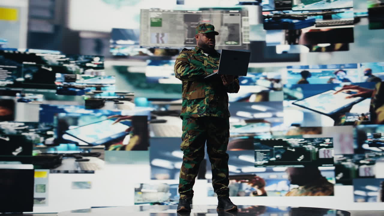 Officer monitoring real time combat data using advanced military systems