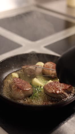 cooking pork medallions in a pan