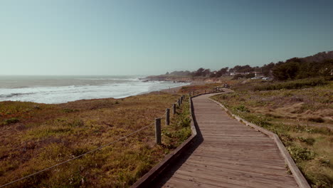 coastal wooden boardwalk at beach with ocean view