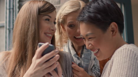 Friends-hanging-out-on-stairwell-using-smart-phone-technology