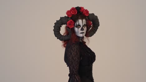 catrina cosplay girl passing by entering frame left to right  with a light background, medium close up