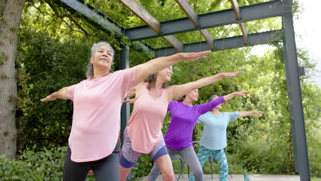 Senior-diverse-group-of-women-practicing-yoga-outdoors