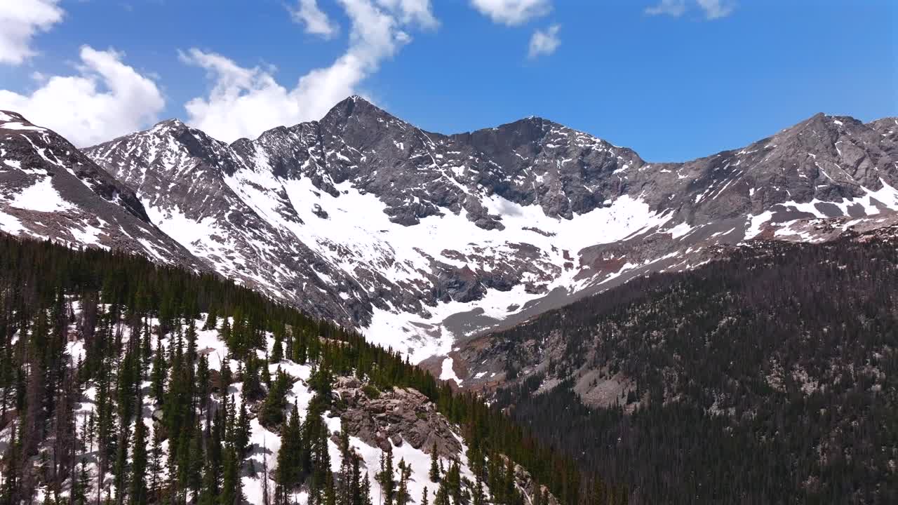 Blanca Peak mount Lindsey Sangre de Cristo Range aerial drone Colorado Rocky Mountains sunny spring summer snow fields blue skies clouds morning San Isabel National Forest Lily Lake trail forward up