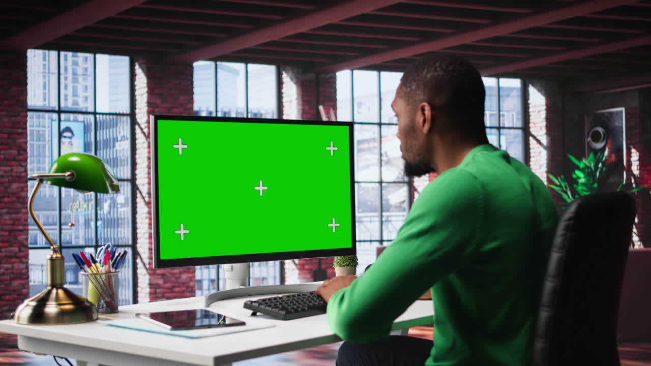 Freelancer completing spreadsheets on isolated chroma key on pc