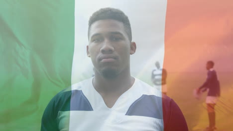 animation of an italian flag waving over an african american male rugby player portrait