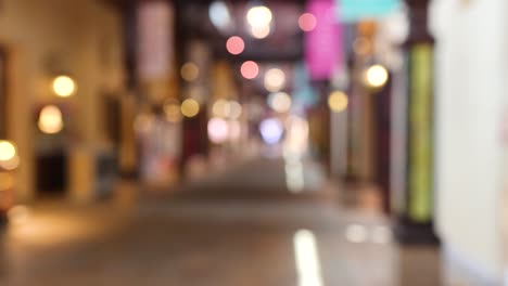 blurred view of a lit alleyway in naples